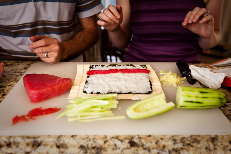 Preparing a homemade philly sushi roll