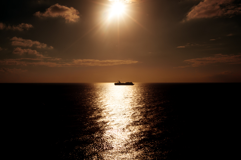 sunset cruise ship silhouette 