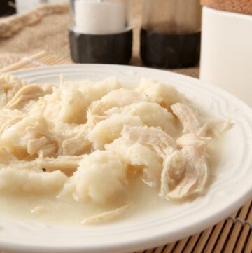 A dish of creamy chicken and dumplings