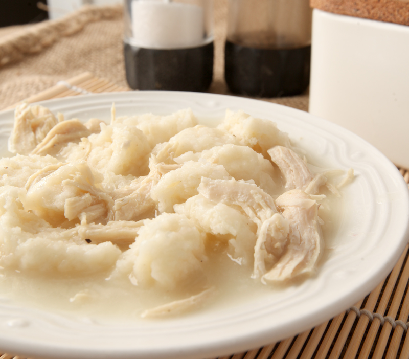 A dish of creamy chicken and dumplings