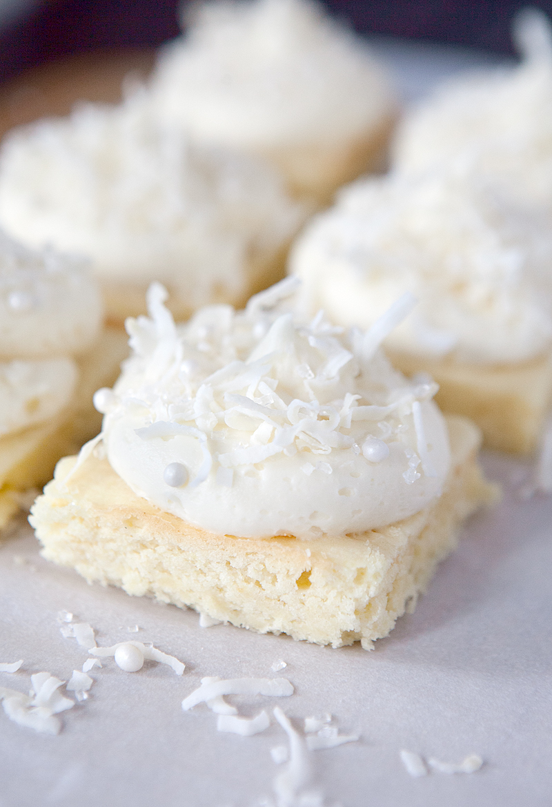Soft lemon bars frosted with a marshmallow fluff coconut frosting. Seriously one of the best desserts I've ever made.