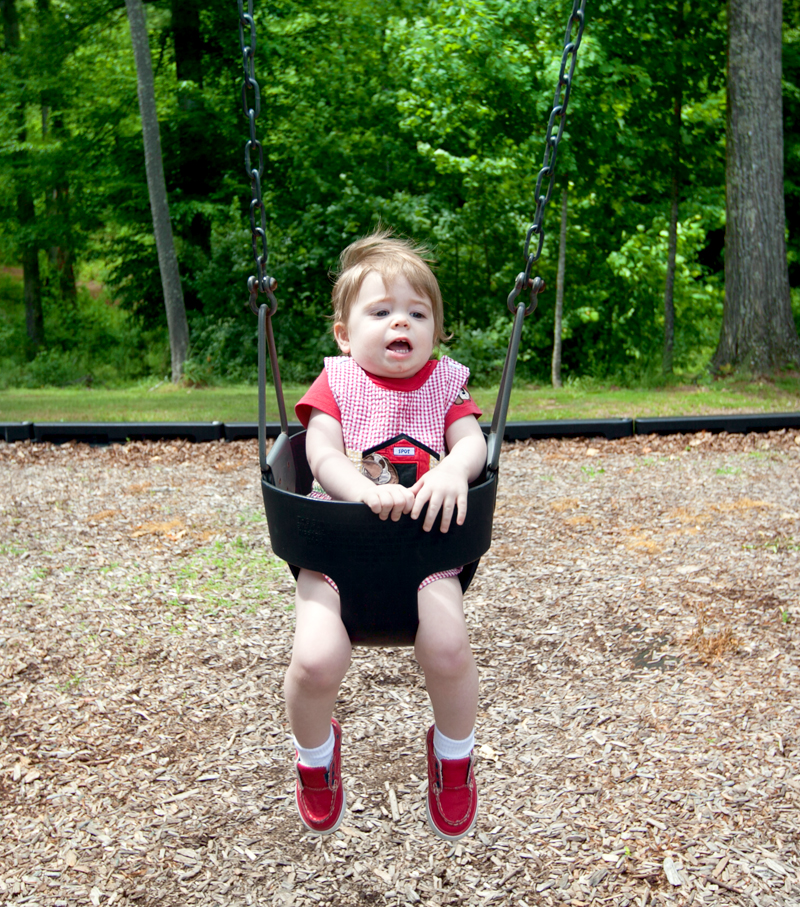 baby in a toddler bucket swing