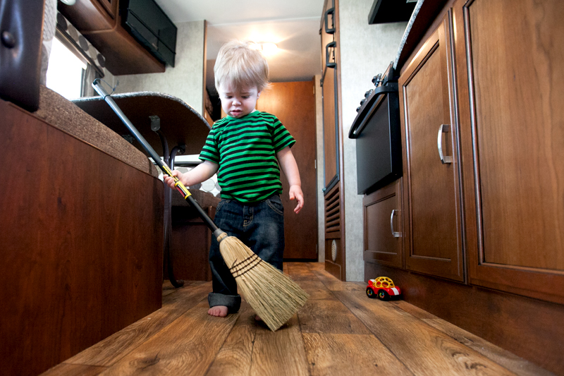 baby sweeping the floor