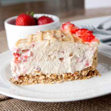 No Bake Peanut Butter Strawberry Fluff Pie is an easy summer treat. A salty crushed pretzel crust balances the sweetness and the addition of marshmallow creme makes each slice extra smooth and creamy. Awesome!