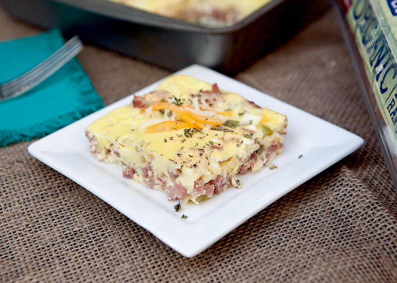 Easy baked breakfast omelet - full of flavorful onions and peppers, cheese, and ham! Fast breakfast idea! 