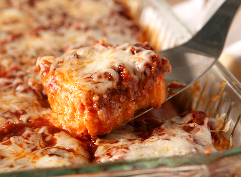 Easy weeknight dinner idea - this cheesy Italian sausage casserole uses pre-made polenta and pasta sauce so you can have it on the table fast!