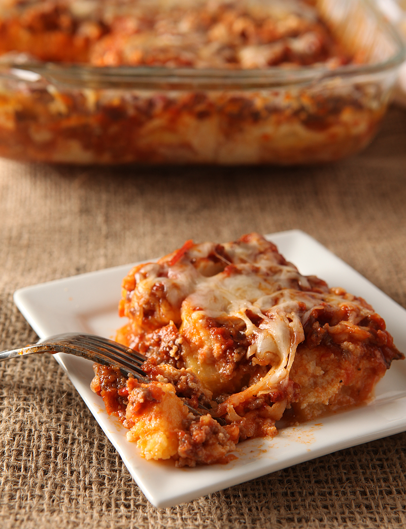 Easy weeknight dinner idea - this cheesy Italian sausage casserole uses pre-made polenta and pasta sauce so you can have it on the table fast!