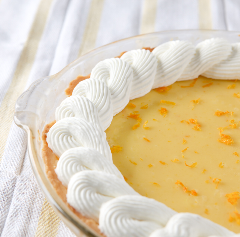 Smooth orange creamsicle pie with the best homemade ginger whipped cream EVER!  Omg so good!