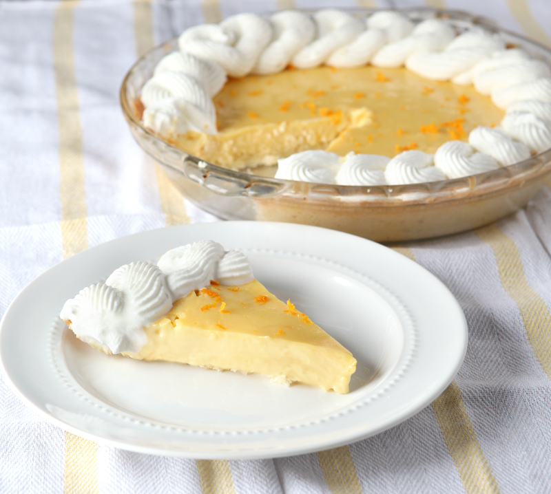 Smooth orange creamsicle pie with the best homemade ginger whipped cream EVER!  Omg so good!