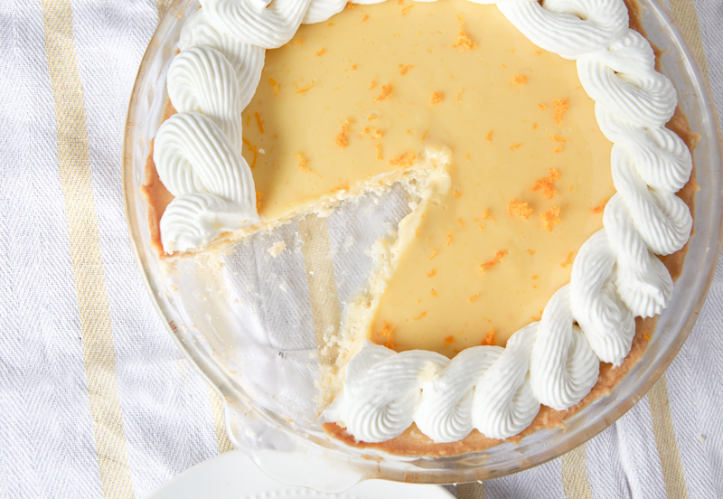 Smooth orange creamsicle pie with the best homemade ginger whipped cream EVER!  Omg so good!