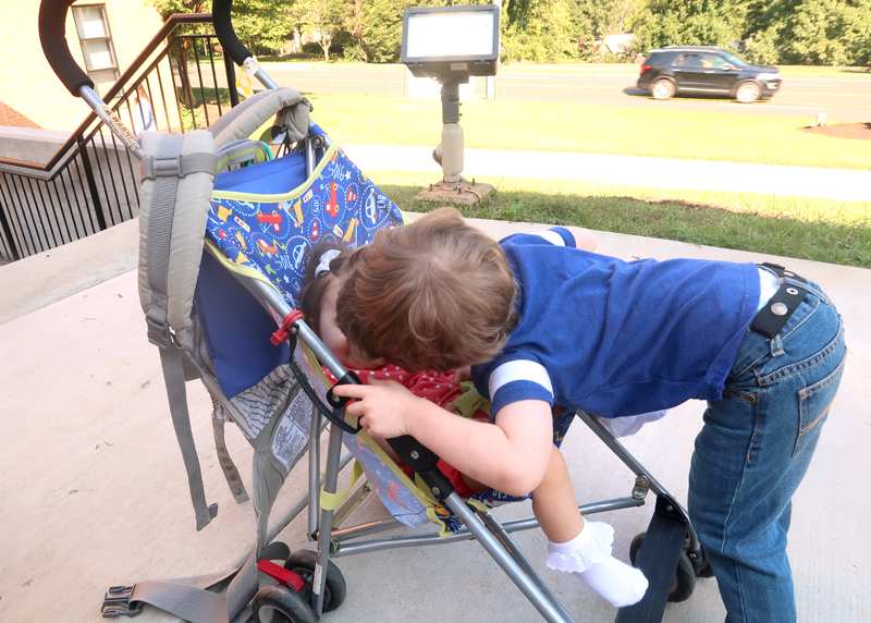 toddler kissing baby