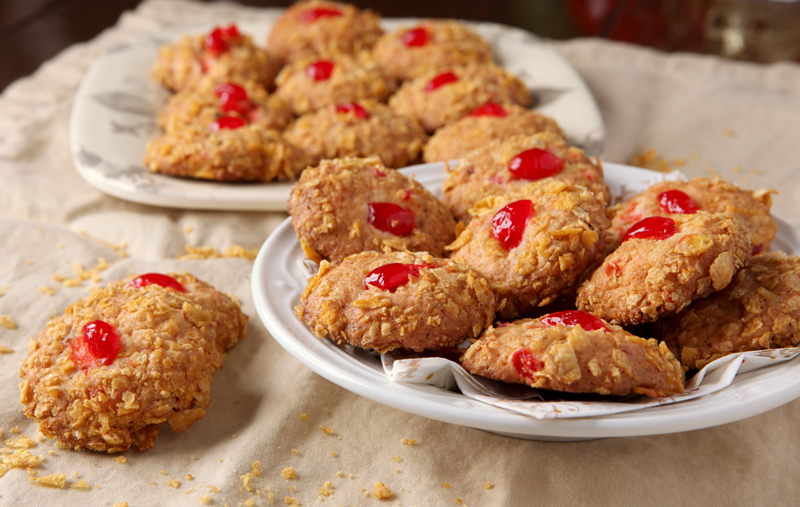 Old Fashioned Cherry Winks cookies rolled in crushed Corn Flakes! There's something so cozy about vintage recipes!