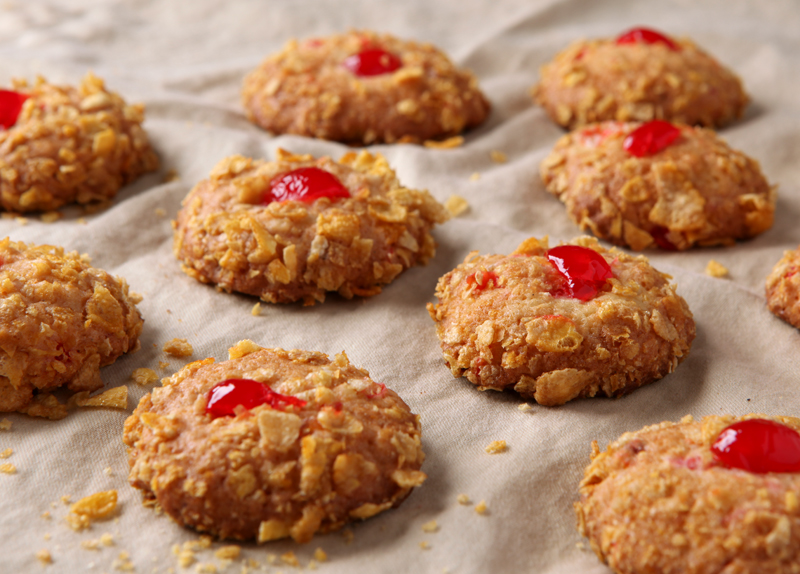 Old Fashioned Cherry Winks cookies rolled in crushed Corn Flakes!  There's something so cozy about vintage recipes!