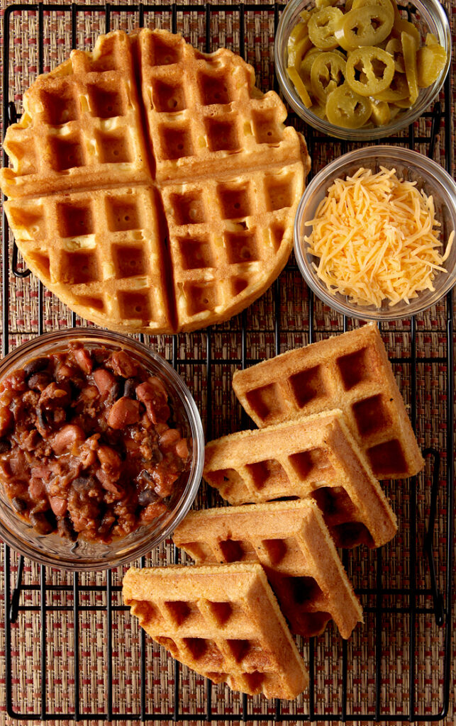 Cornbread Waffles with Three Bean Chili. Perfect cornmeal waffles loaded up with a thick, flavorful three bean and beef chili. Great unique dinner idea! 