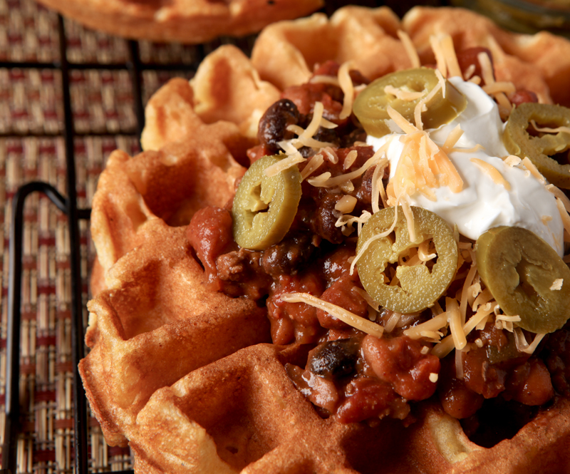 Cornbread Waffles with Three Bean Chili. Perfect cornmeal waffles loaded up with a thick, flavorful three bean and beef chili. Great unique dinner idea! 