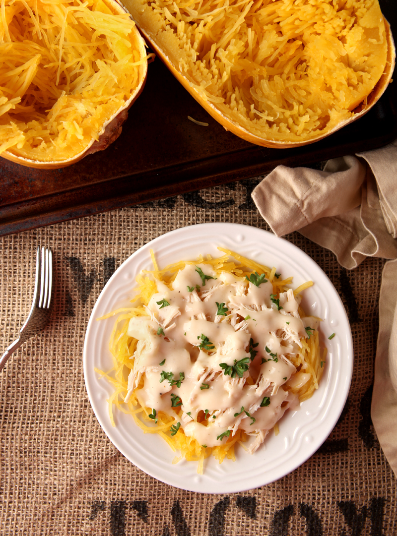 Low calorie spaghetti squash chicken alfredo - a great alternative to higher calorie alfredo pasta, and how to cook perfect al dente spaghetti squash that is not watery!