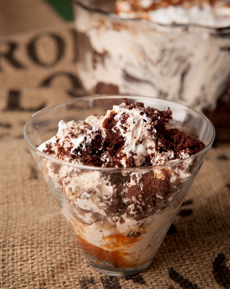 Chocolate turtle trifle - layers of chocolate cake, homemade caramel mousse, pecans, caramel drizzle, and whipped cream make this one amazing dessert that feeds a crowd!