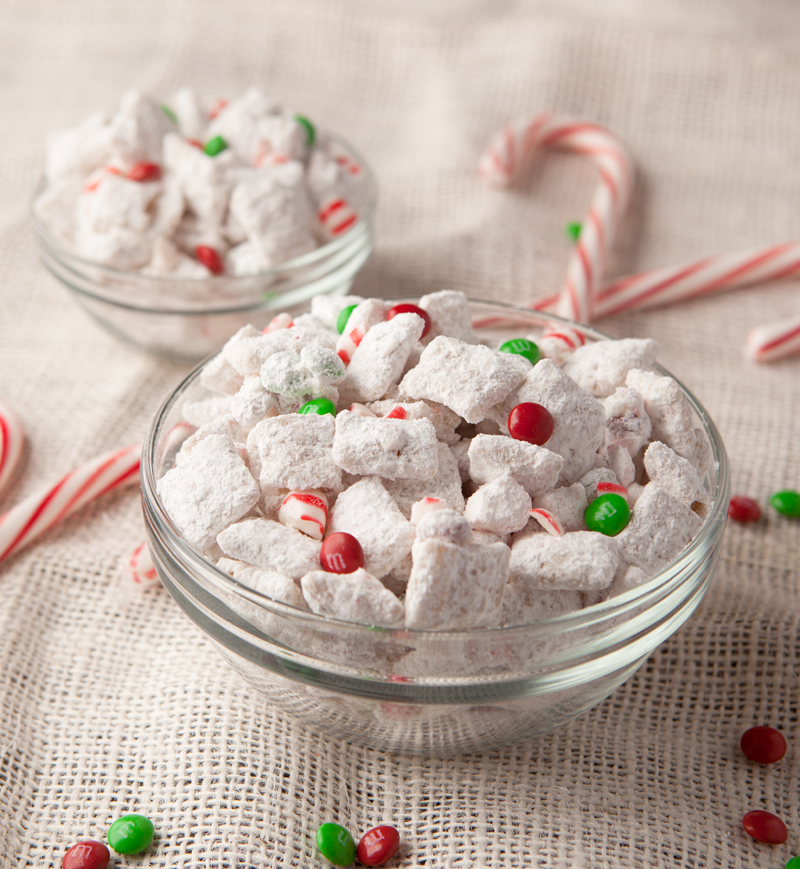 White chocolate coated rice chex cereal mixed with mini M&M's, crushed peppermint and dusted with powdered sugar. An easy Christmas snack mix!