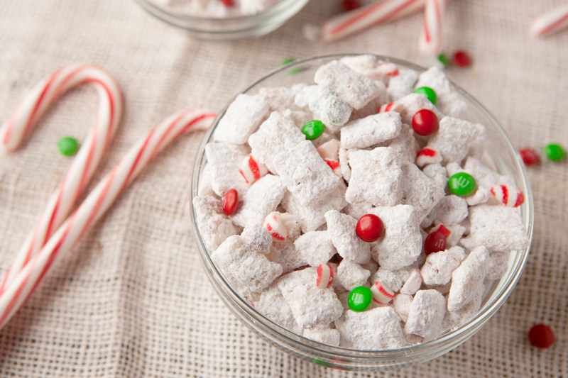 White chocolate coated rice chex cereal mixed with mini M&M's, crushed peppermint and dusted with powdered sugar. An easy Christmas snack mix!