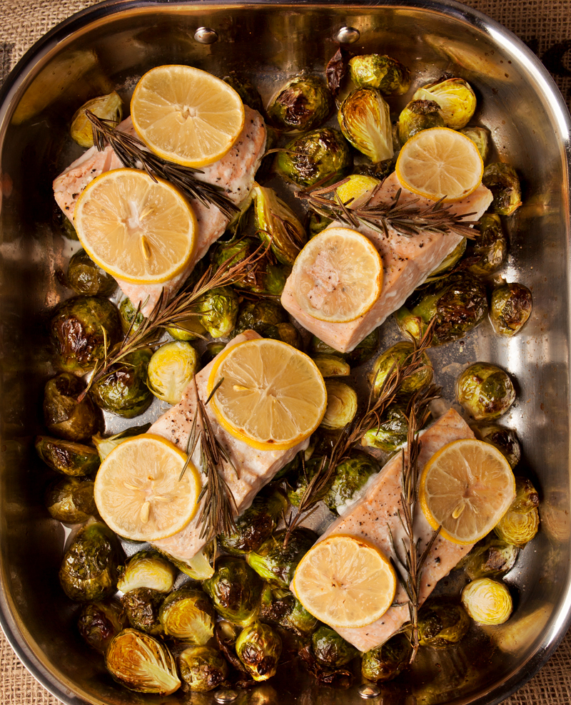 Delicious lemon herb roasted salmon with fresh rosemary and lemon slices