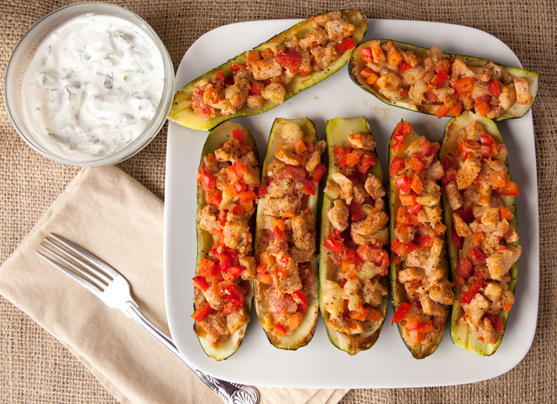 Easy and Fast Low Carb Dinner Idea! Chicken Stuffed Zucchini boats with a a fresh lemon mint topping. I could eat the whole recipe myself