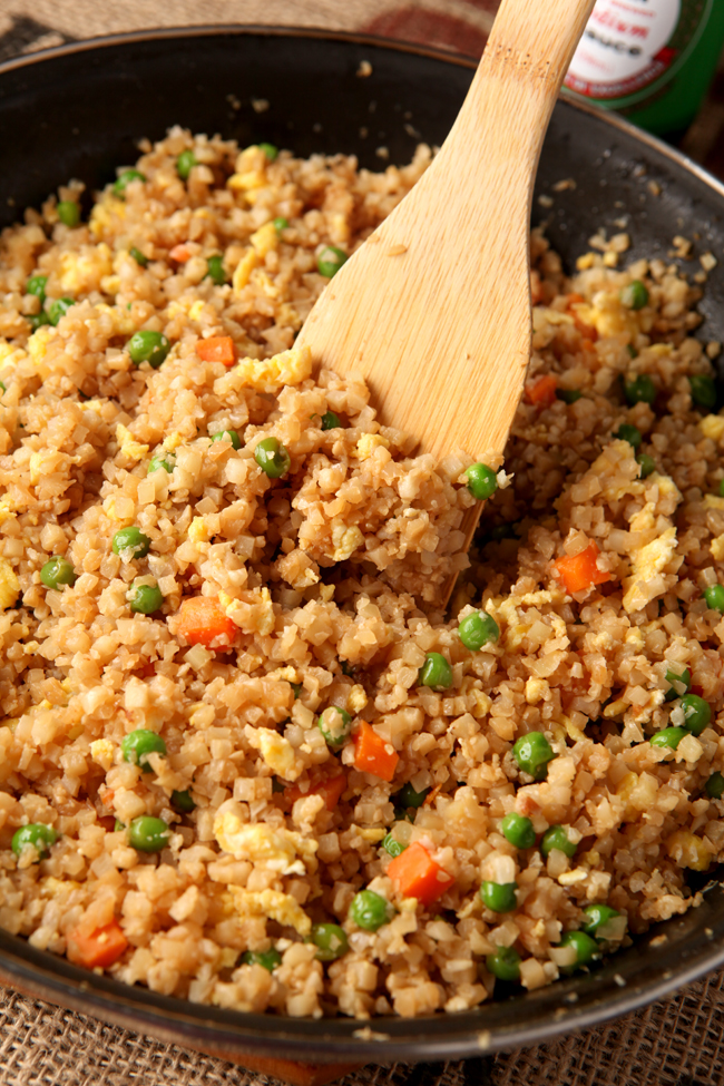 Do you miss yummy Chinese take-out on a low carb diet?  This fried cauliflower rice NEEDS to be in your life!  I promise you it can pass for the real thing - use this cauliflower chinese fried rice on its own, add chicken, or serve with any of your favorite low carb chinese dishes!  Seriously it's so good, you HAVE to try it!  