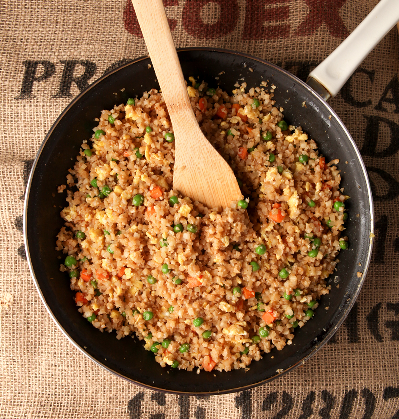 Do you miss yummy Chinese take-out on a low carb diet?  This fried cauliflower rice NEEDS to be in your life!  I promise you it can pass for the real thing - use this cauliflower chinese fried rice on its own, add chicken, or serve with any of your favorite low carb chinese dishes!  Seriously it's so good, you HAVE to try it!  