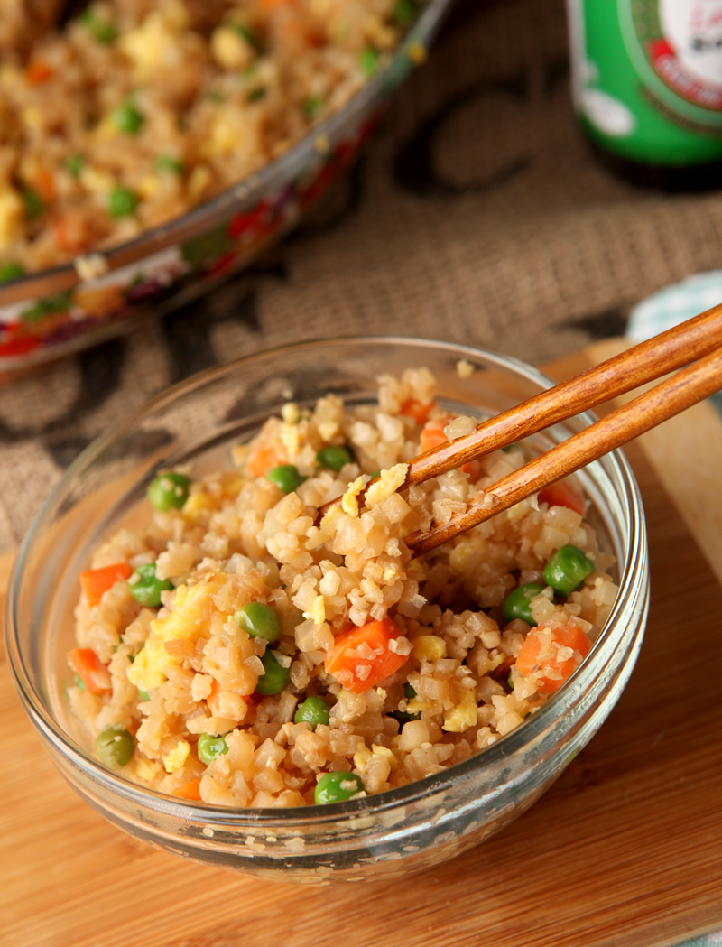 Do you miss yummy Chinese take-out on a low carb diet?  This fried cauliflower rice NEEDS to be in your life!  I promise you it can pass for the real thing - use this cauliflower chinese fried rice on its own, add chicken, or serve with any of your favorite low carb chinese dishes!  Seriously it's so good, you HAVE to try it!  