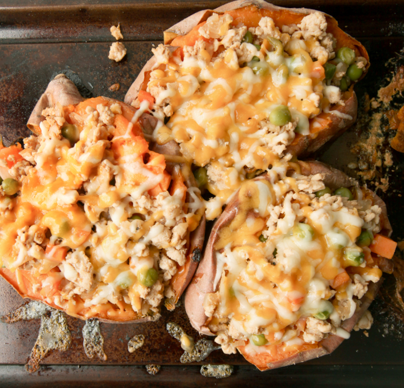 Baked sweet potato stuffed with a Shepherd's Pie filling - cheesy, easy dinner idea that's a riff on a classic favorite.