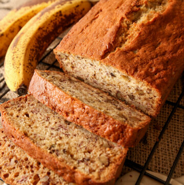 A sliced loaf of delicious banana nut bread