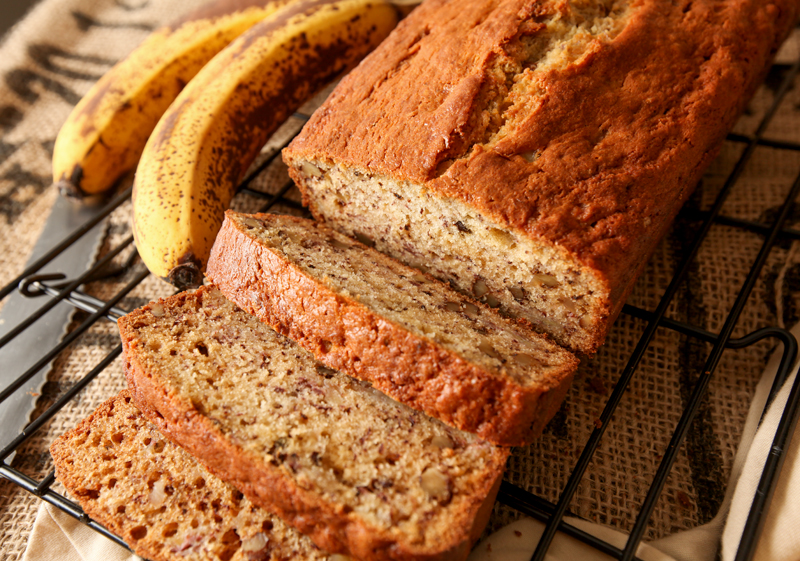 A sliced loaf of delicious banana nut bread