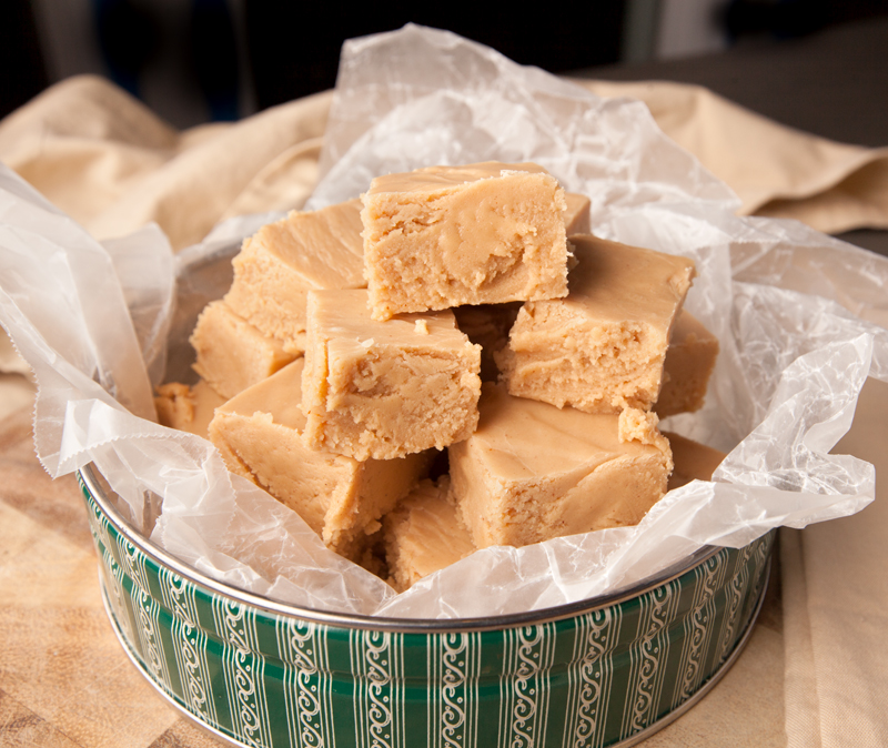 A holiday tin filled with creamy peanut butter fudge.