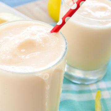 Close up of frosted lemonade with a drizzle leaking down the side of the glass