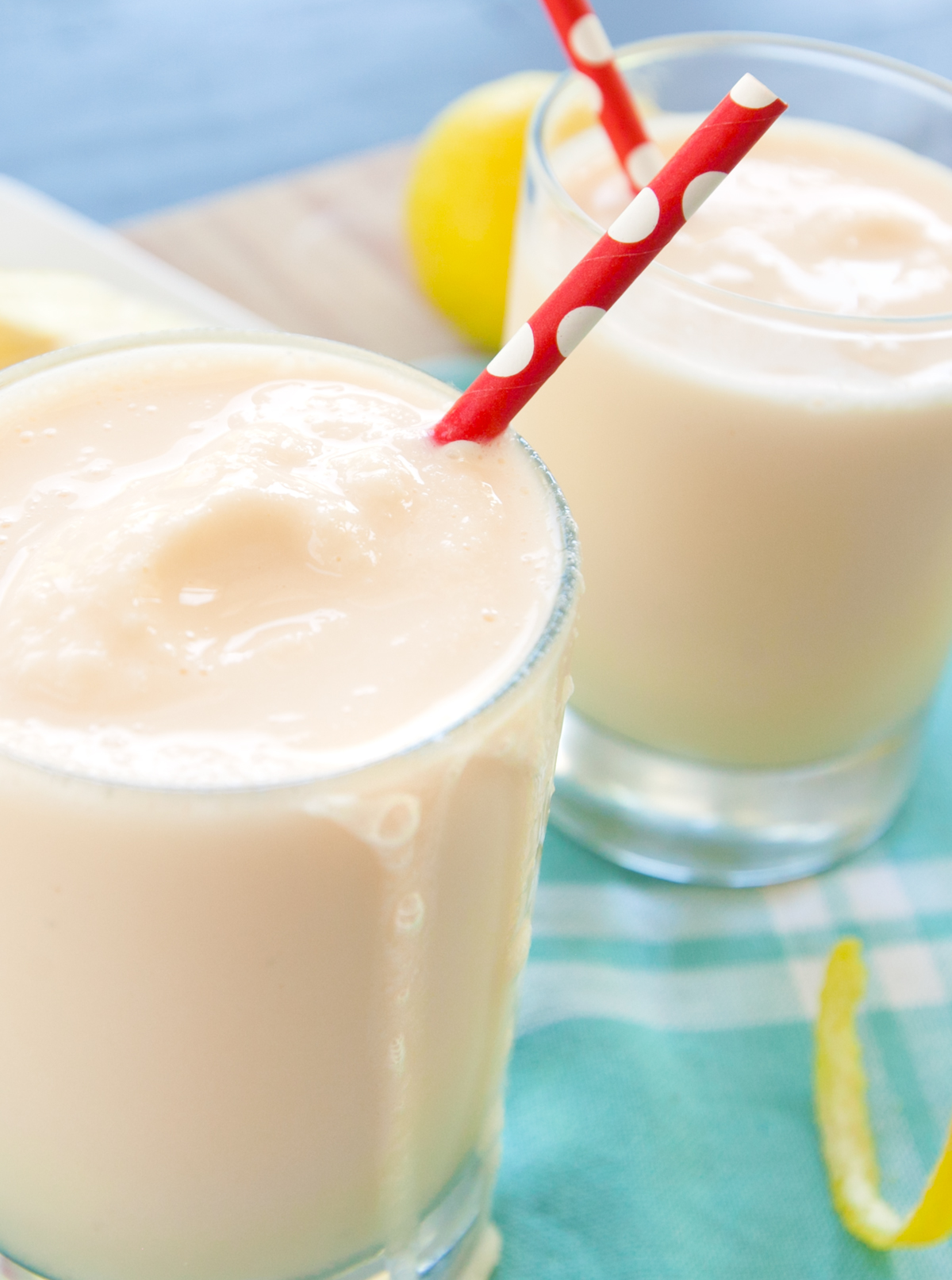 Close up of frosted lemonade with a drizzle leaking down the side of the glass