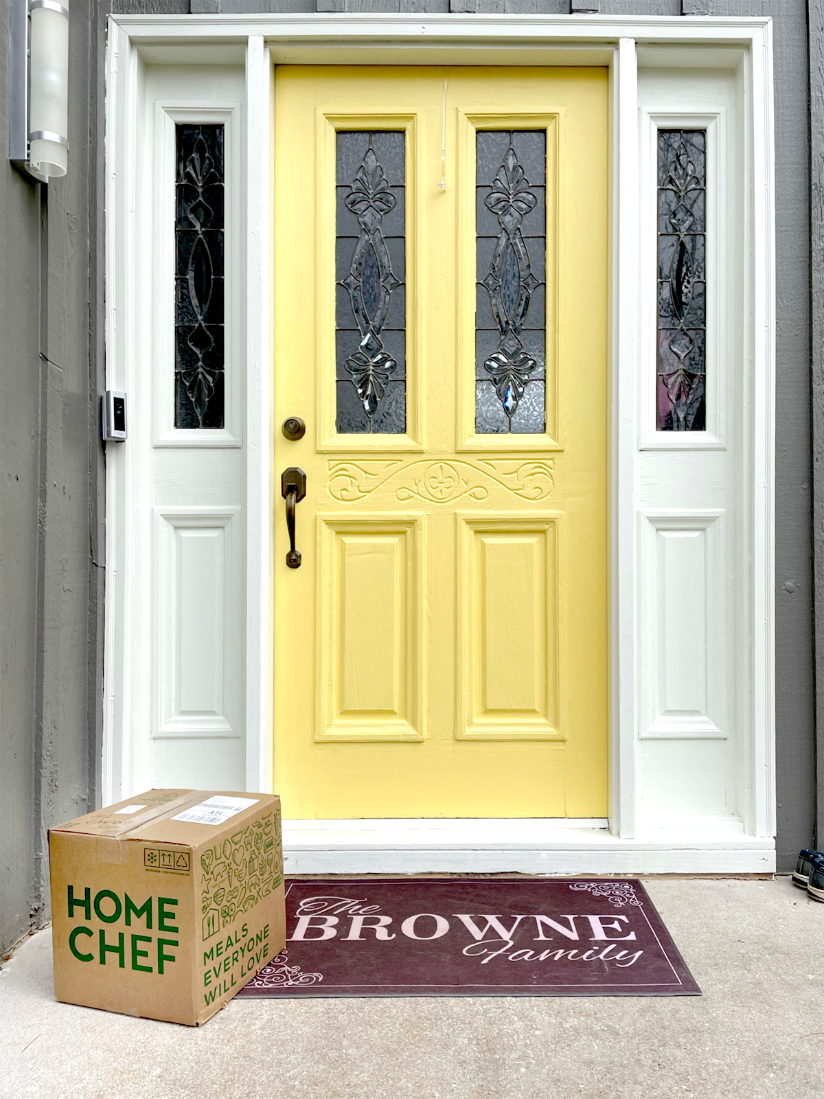 A Home Chef box sitting on a front porch