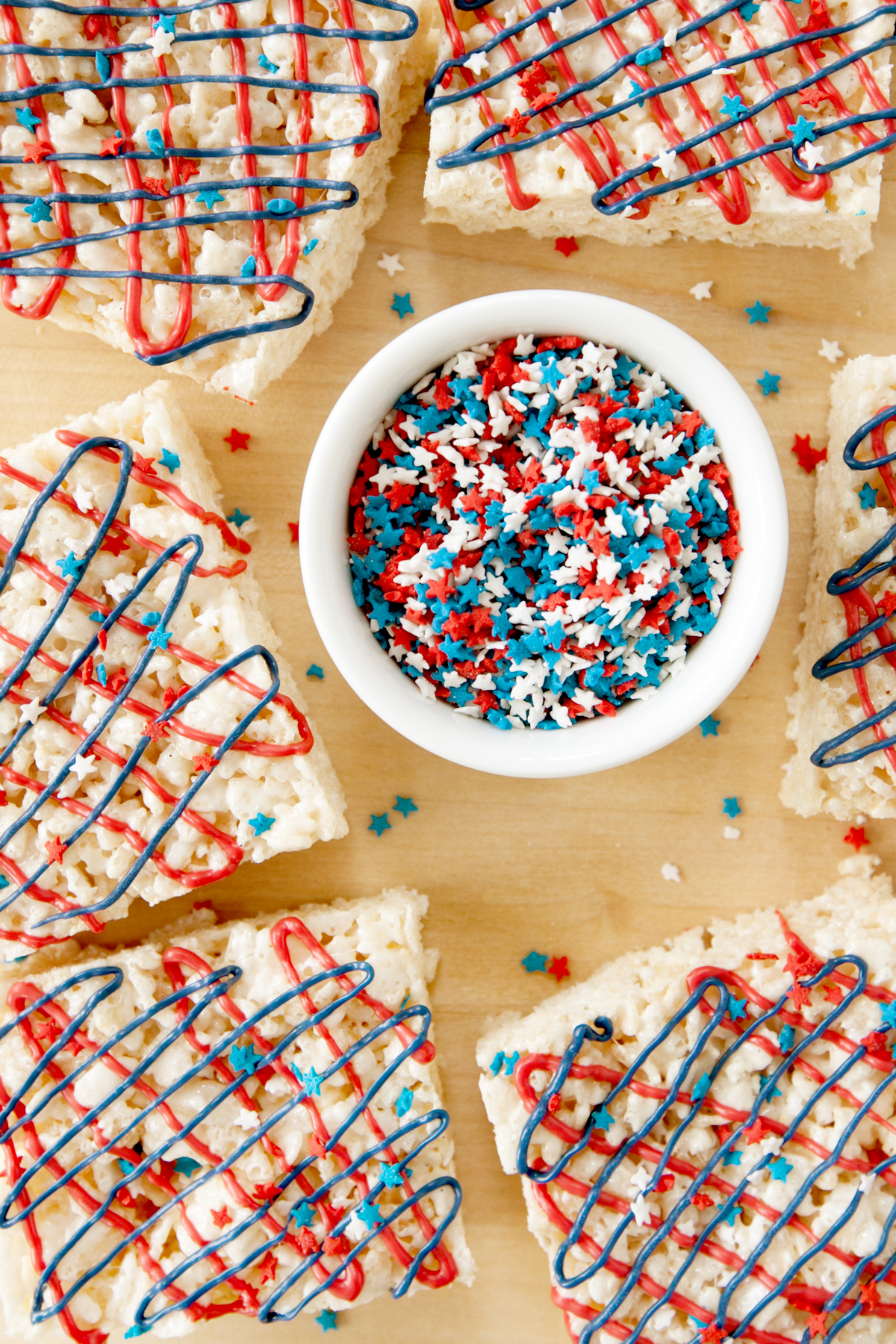 red white and blue sprinkles surrounded by patriotic rice krispie treats