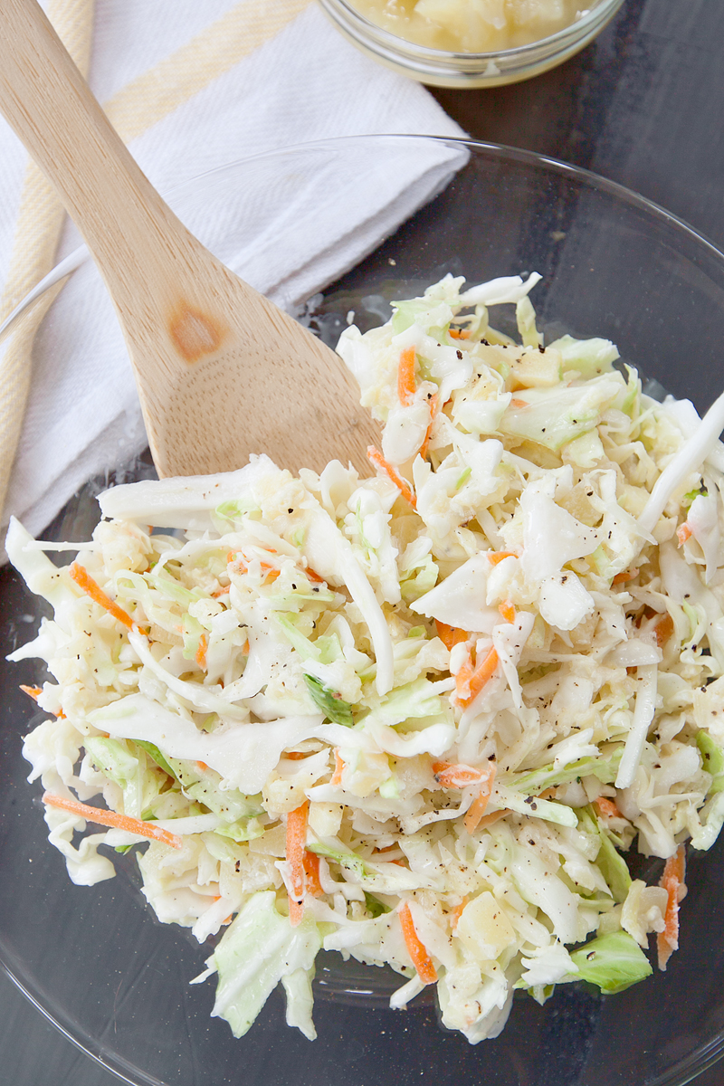 overhead view of hawaiian coleslaw with wooden spoon