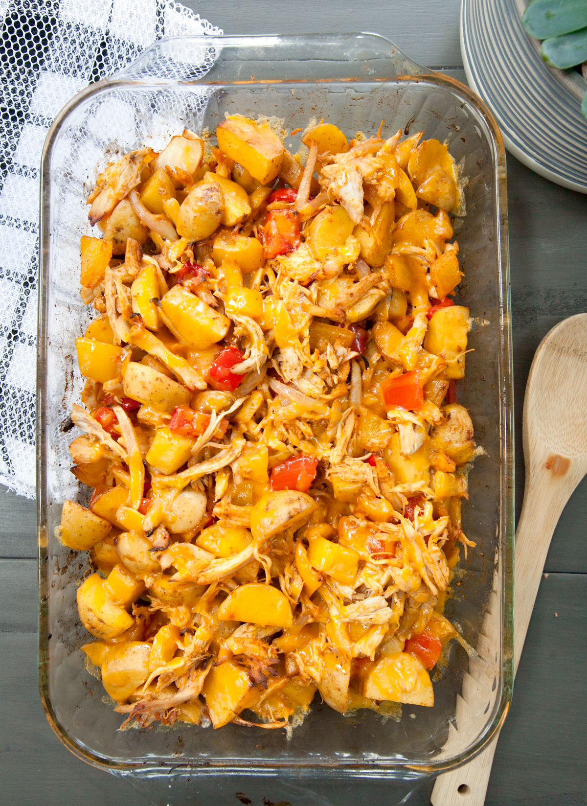 overhead view of a chicken and potato bake with cheese