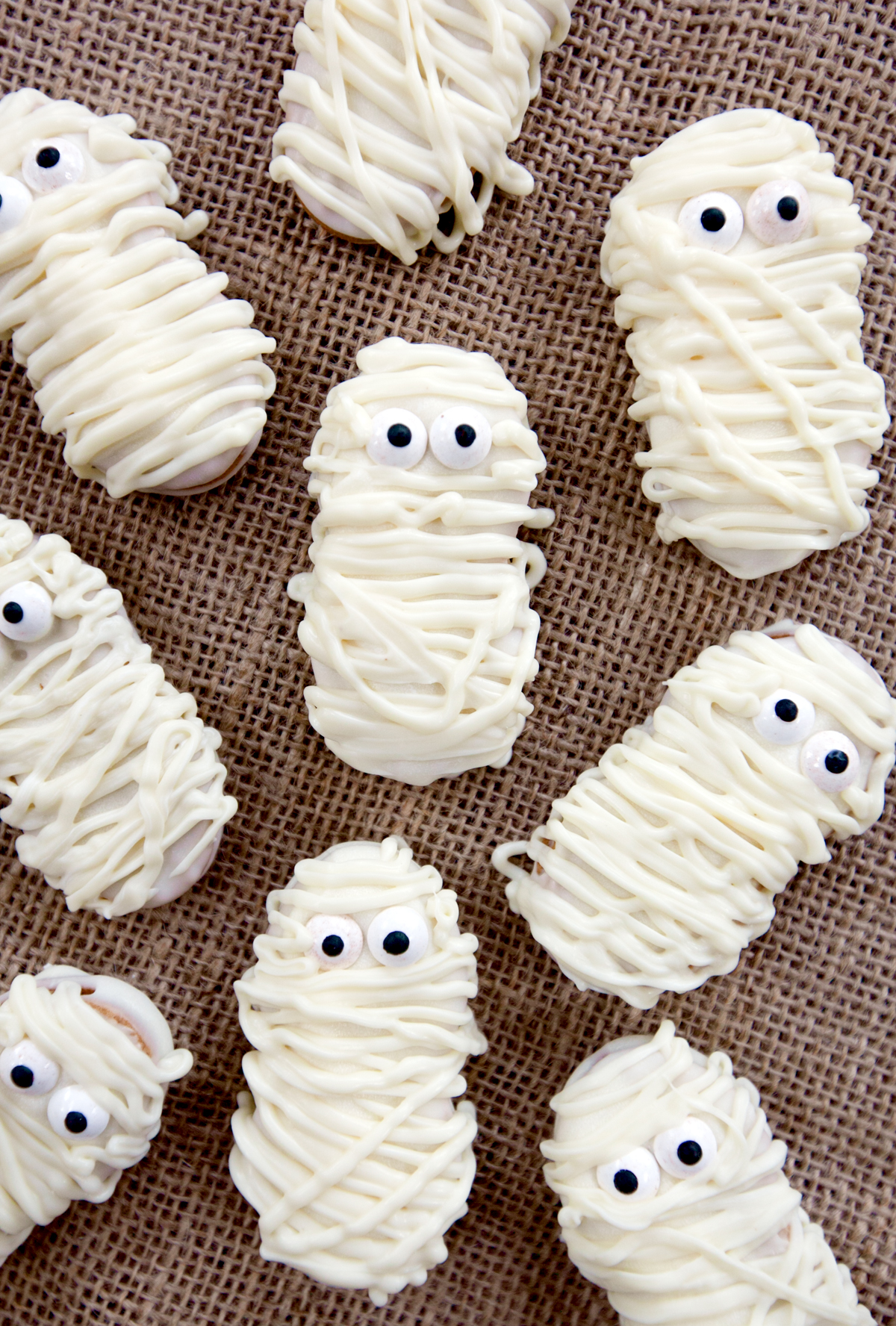 overhead view of halloween cookies that look like mummies, made out of Nutter Butter
