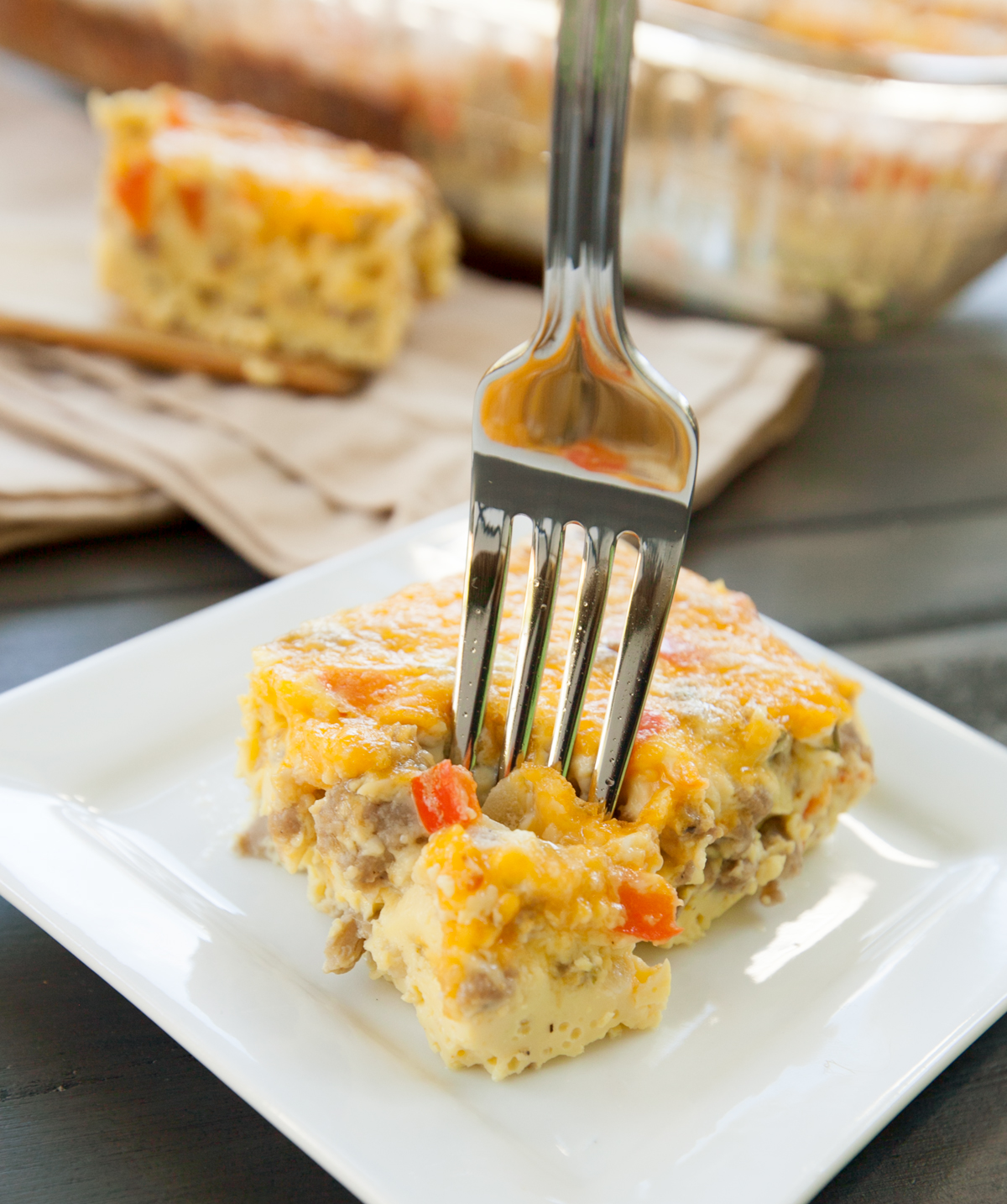 A slice of low carb casserole with a fork sticking out of the top.