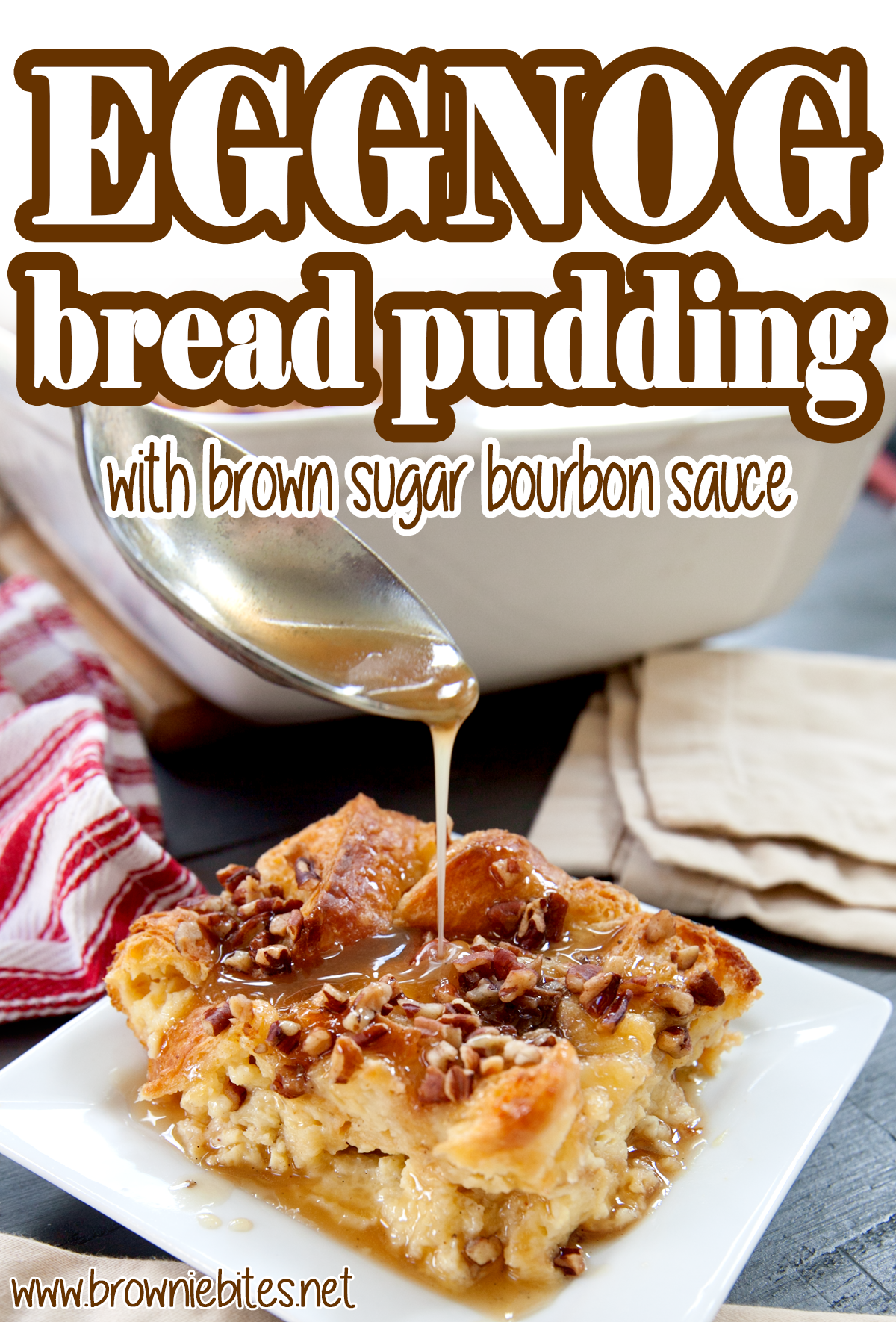 a slice of eggnog bread pudding on a plate with a spoon drizzling on some brown sugar bourbon sauce, with text for Pinterest