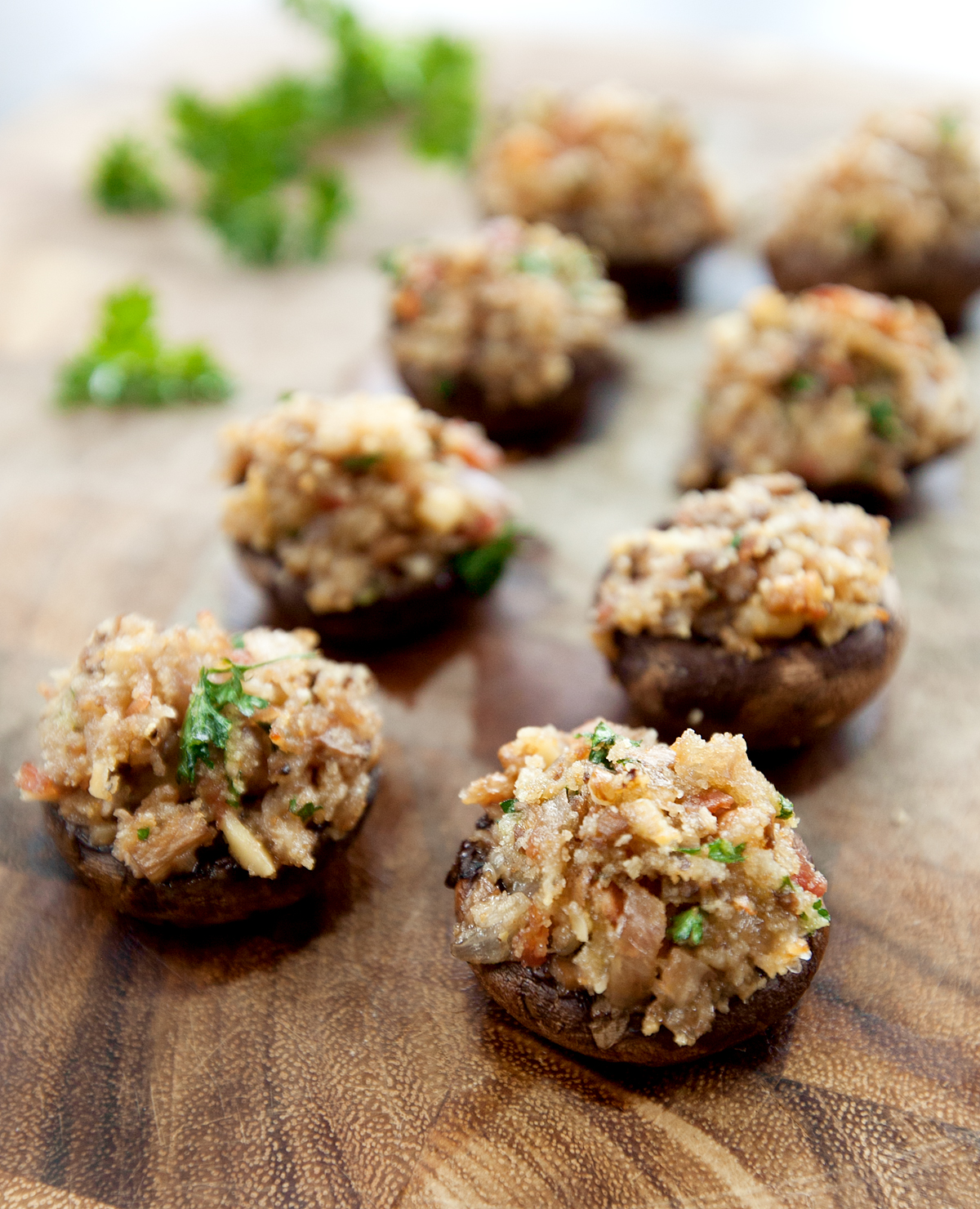 lined up stuffed mushrooms with bacon and walnuts in the filling