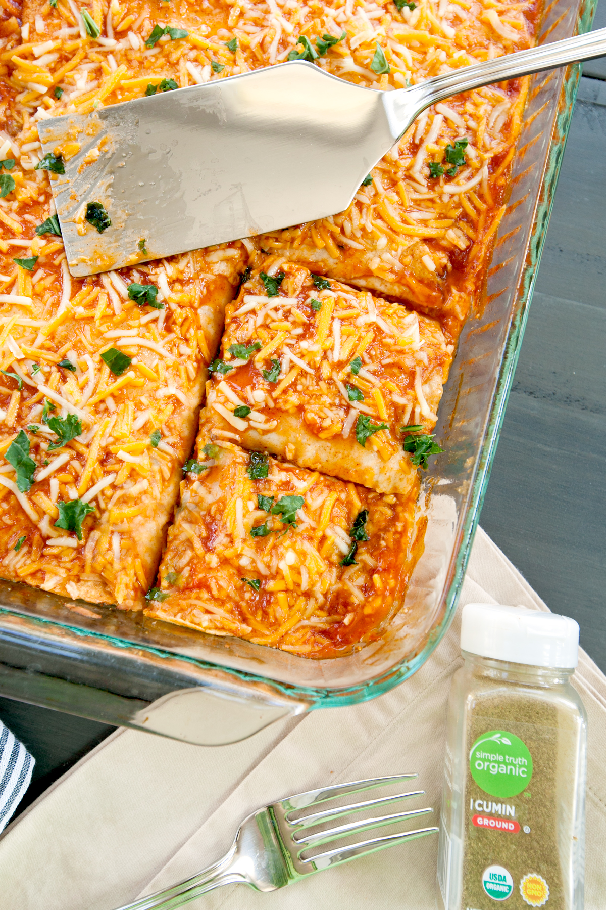 Overhead shot in a keto chicken enchilada casserole with a couple of cuts made for servings.