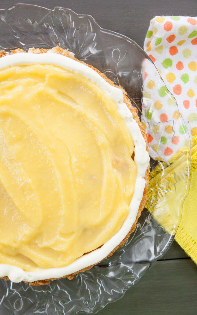 Overhead view of a lemon lime curd filling being held inside by a buttercream dam.