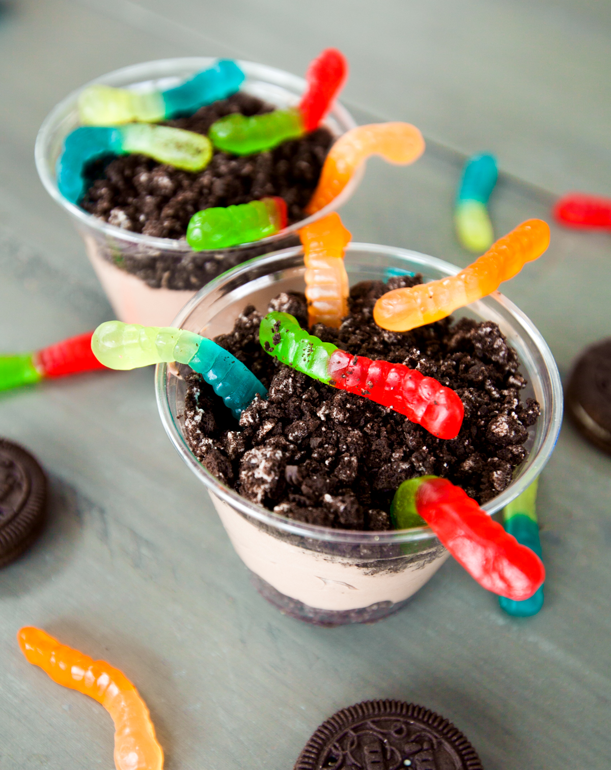 Dirt and worms with colorful gummy worms and delicious chocolate cookie crumbs.