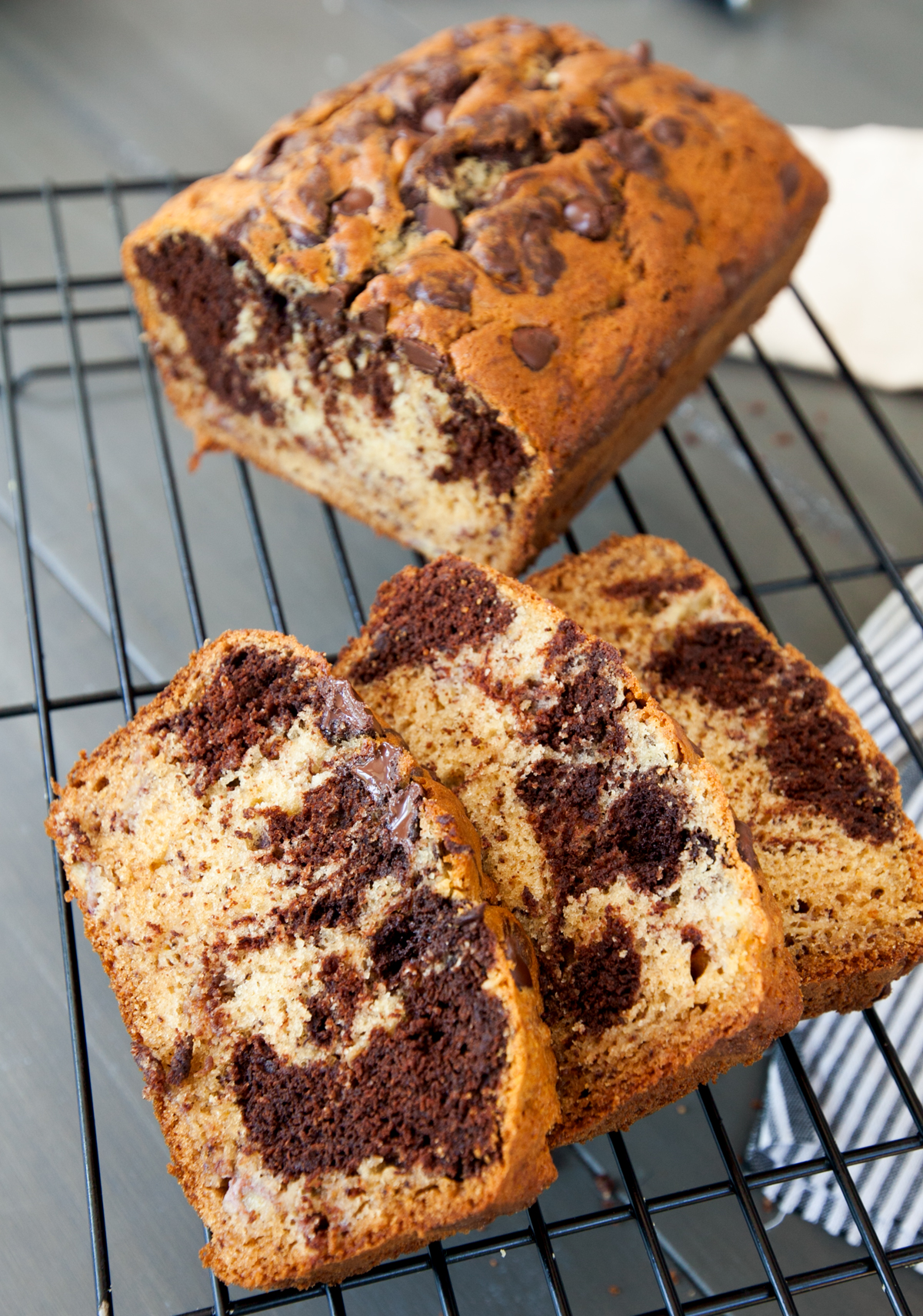 Close up of slices of chocolate banana swirl loaf cake.