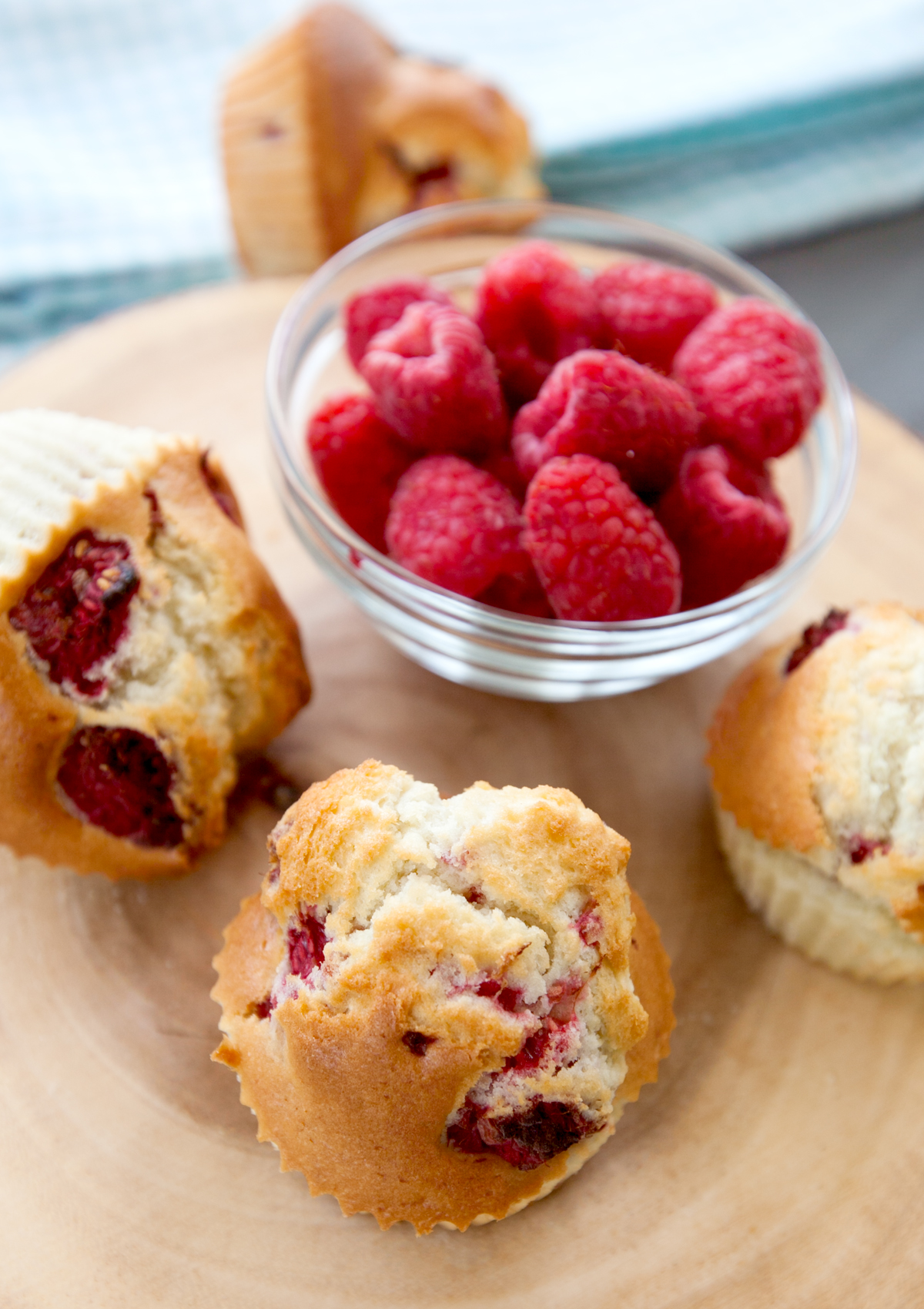 Overhead view of golden raspberry muffins using a muffins in air fryer recipe.