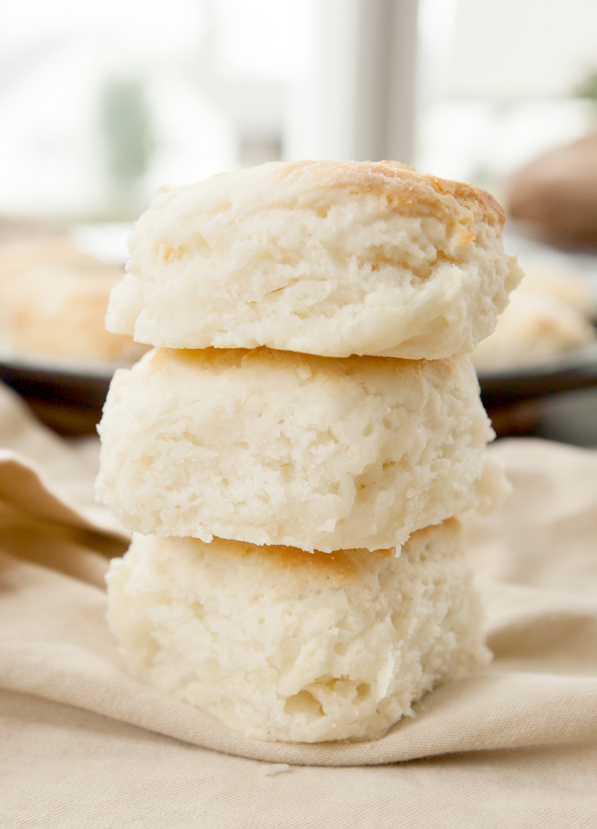 A stack of 3 tall fluffy buttermilk biscuits using Brenda Gantt's method.