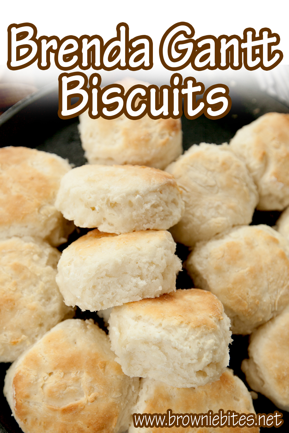 Overhead view of fluffy buttermilk biscuits with text for Pinterest.