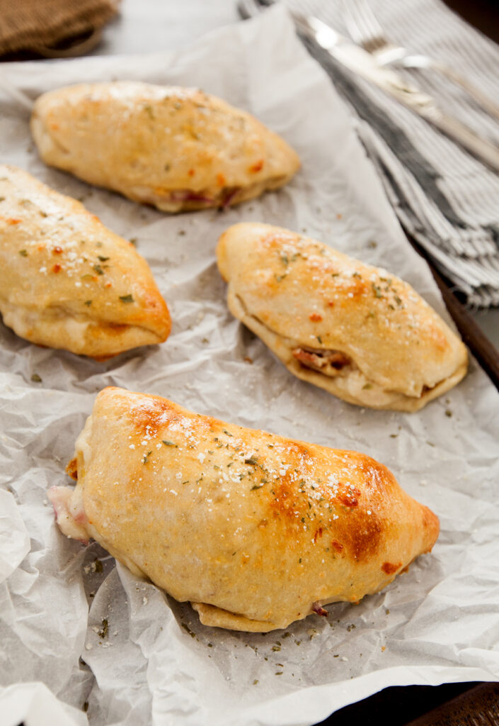 A pan of golden chicken bacon ranch calzones.